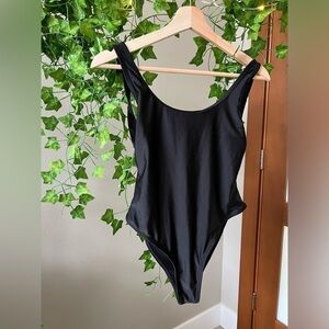 Black one piece swim suit with low back size medium